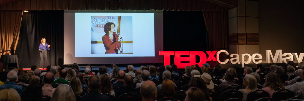 Dani Klein Modisett speaking at a Laughter On Call event