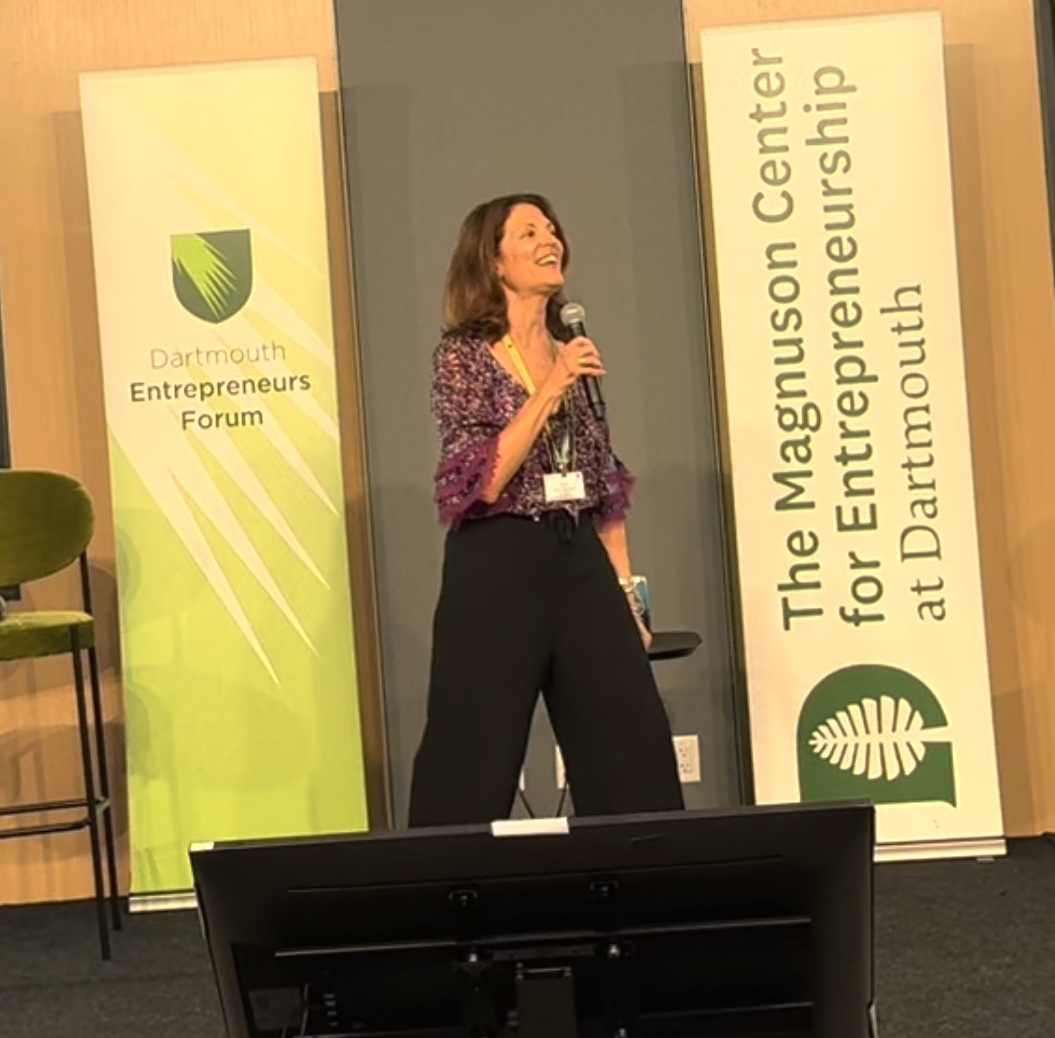 Dani speaking on stage